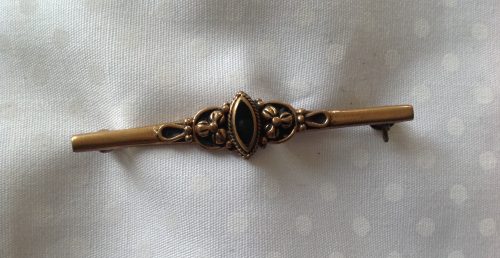 Art Nouveau goldtone and black stone stock pin